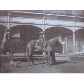 Unidentified woman and child on horseback