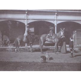 Unidentified woman and child on horseback