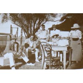 Unidentified group at tennis having tea