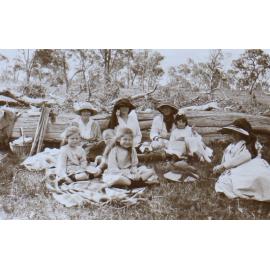 Unidentified group of women and children having a picnic