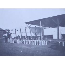 Unidentified men with large buckets and furnaces