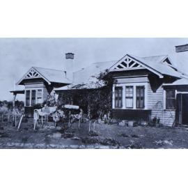 Unidentified house with a car in front