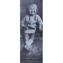 Young girl sitting on a foot stool
