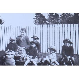 Group of children with sacks of pine cones
