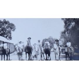 Group of children all on horseback