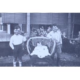 Two boys with a baby