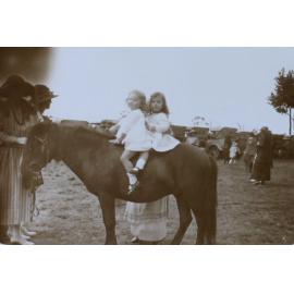 Two young girls on horseback