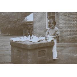 Young girl cleaning shoes