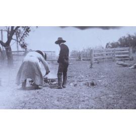 Two men beside a fire