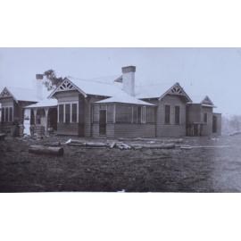 Woman outside a house