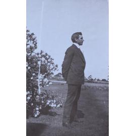 Unidentified man in profile in the garden