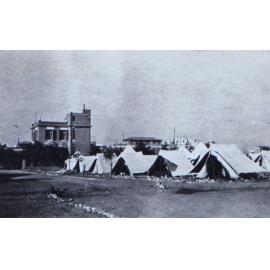Army bivouac near permanent buildings