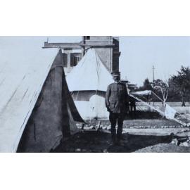 Officer outside a tent