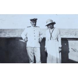 Naval officer and woman onboard a ship