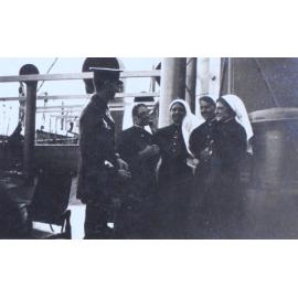 An officer and four nurses onboard a ship