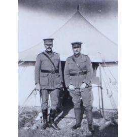 Two officers outside a tent