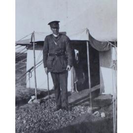 A chaplain outside a tent