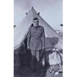 A chaplain outside a tent