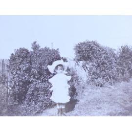 Young girl standing in the garden