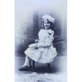 Young girl sitting with bowl and spider