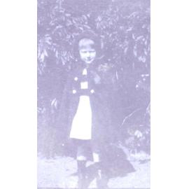 Young girl standing in the garden