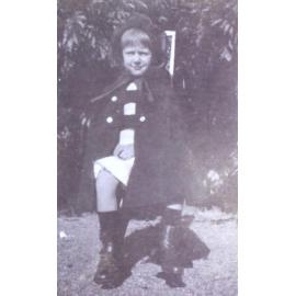 Young girl sitting on a chair in the garden