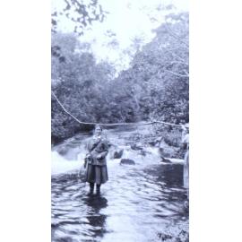 Two women fishing - standing in water