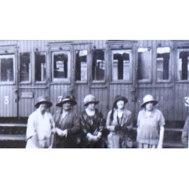 "Farewell" Group of women in front of a train