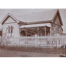 Small house with picket fence