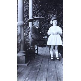 Man and a girl on the verandah