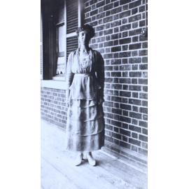 Woman standing on the verandah