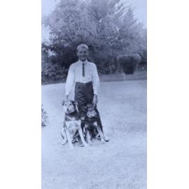 Young boy with two pet dogs