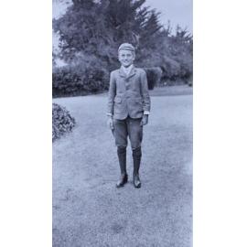 Young boy standing on the lawn