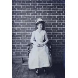 Woman sitting in a chair on the verandah