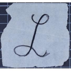 Loose sheet of paper with an L on it