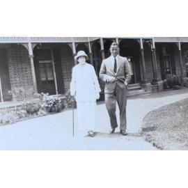 Unidentified man and woman standing in front of Saumarez Homestead