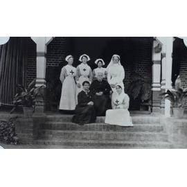 Group of nurses sitting on the steps
