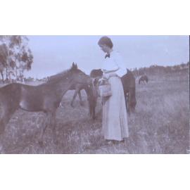 Unidentified woman with a foal