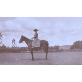 Unidentified woman on horseback