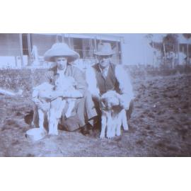 Unidentified couple with five pet lambs