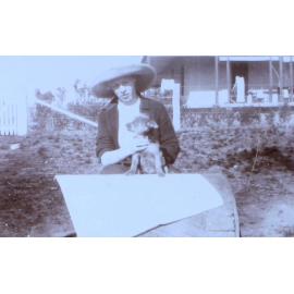 Unidentified woman with pet dog