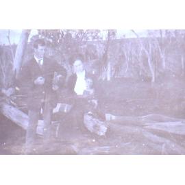 Unidentified couple with pet dog