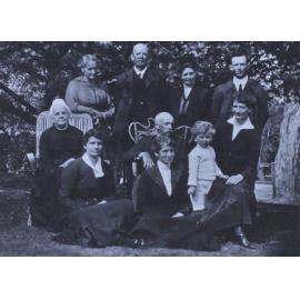 Group of unidentified men, women and a child