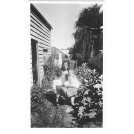 Ida Joseph with her two sons, Roy and Eric, in the garden in their first home behind the J.S. Draper store in Grey Street, Glen Innes, 1927