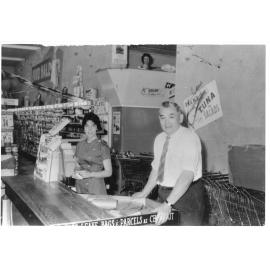 Tom Loy and unidentified shop assistant in the Food Hall in the Hong Yuen store, Inverell, c.1960 
