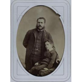 A cabinet photo of an unidentified man and boy