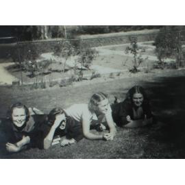 Students on the southern lawns of Booloominbah with rose garden in view. Pam Harris, Bec Bryden, Rae Anthony, Lucy Johnston