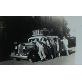Students pose with car outside Booloominbah, NEUC, 1941