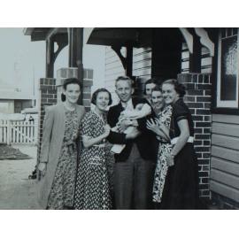 Students at Voisey house photographed with new baby Y. Voisey