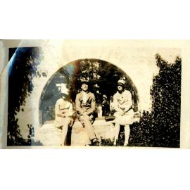 Three People in a Garden